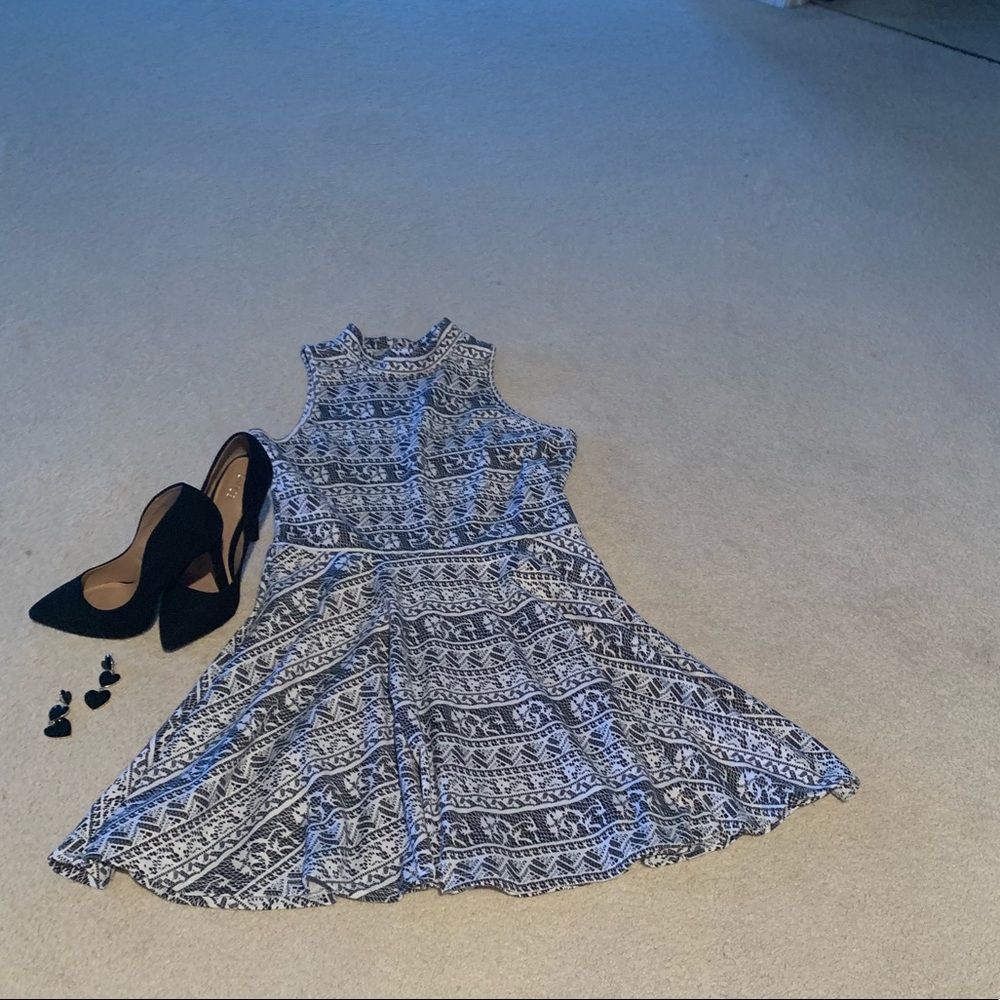 Black and white sleeveless skater dress.